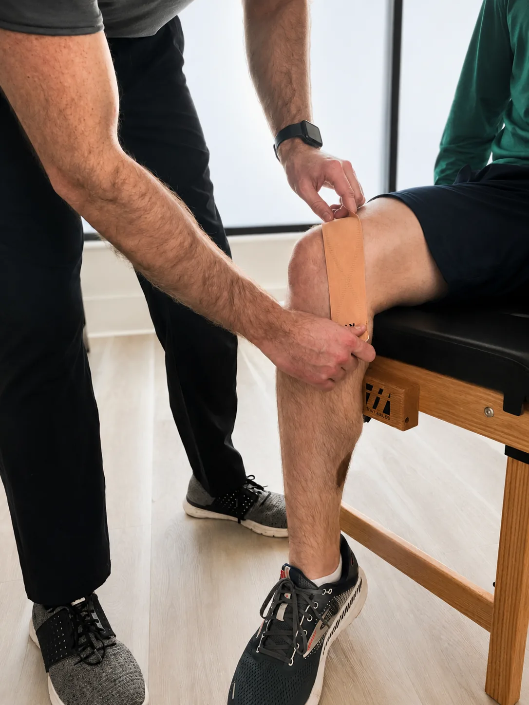 Dr. Mathias assessing a patient’s knee
