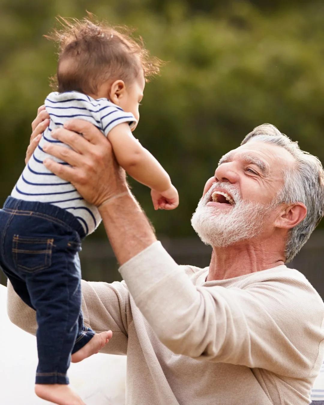 Parent lifting their child, pain-free after rehab