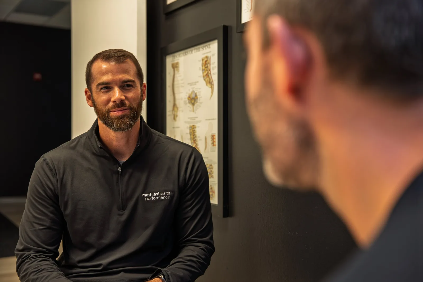 Dr. Mathias in consultation with a patient